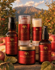 Orchard Face serum and balms close up in the orchard